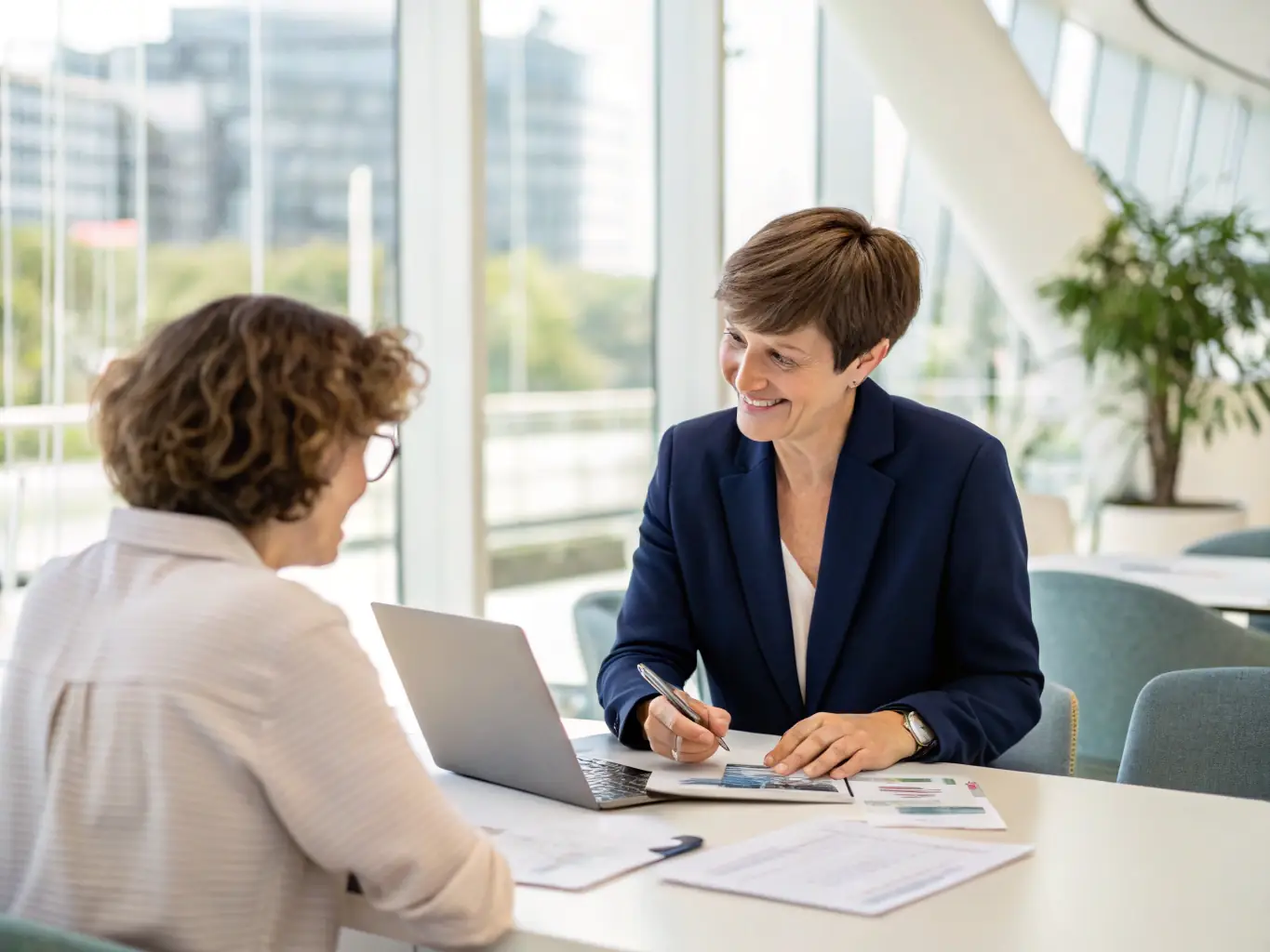 A financial advisor providing personalized guidance to a client in a modern office setting.